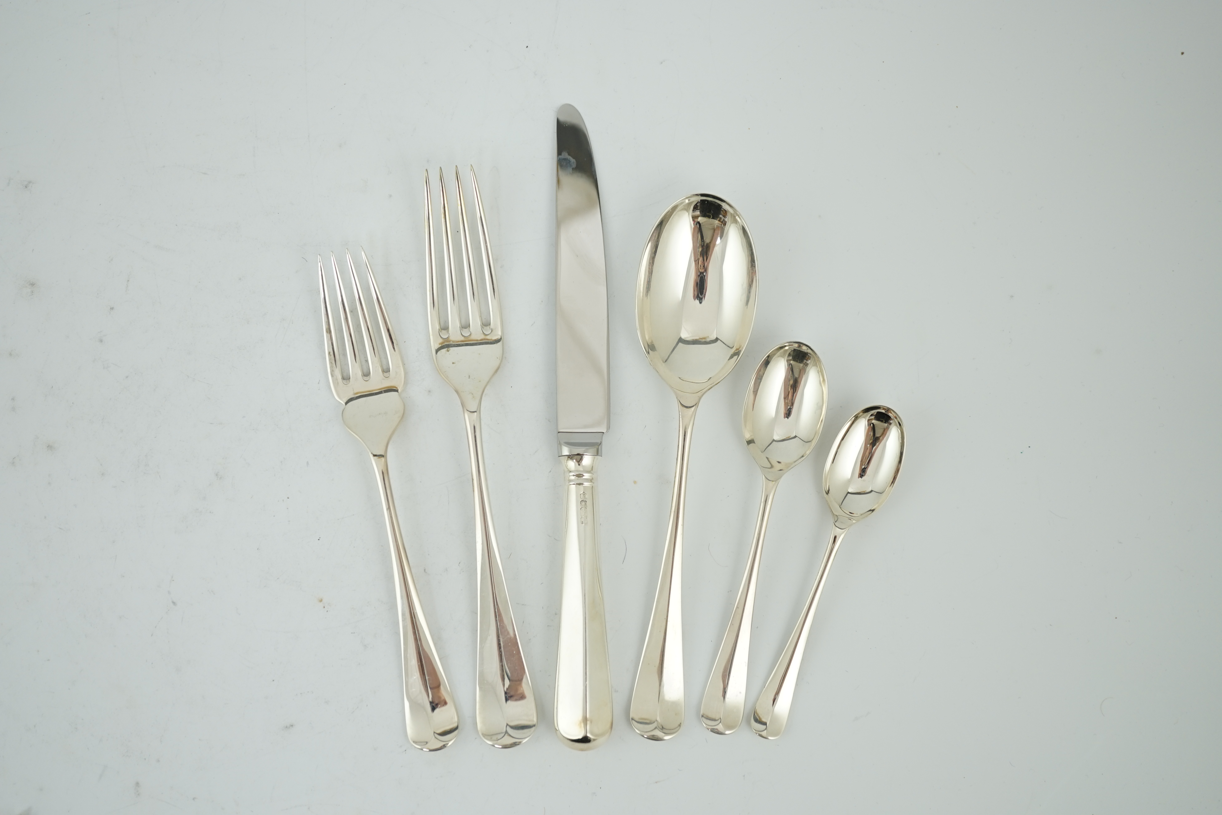 An Elizabeth II complete canteen of silver Hanovarian rat-tail pattern cutlery for twelve, by Carr's of Sheffield